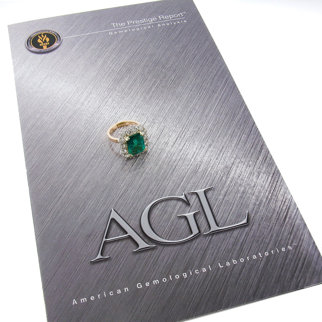 Vintage 18k Gold 7.83ct AGL Colombian Emerald Diamond Halo Ring: Vintage 18k Gold 7.83ct AGL Colombian Emerald Diamond Halo Ring This stunning vintage cocktail ring features a striking 7.83ctw AGL Colombian emerald at its center, surrounded by a halo of 14 brillian