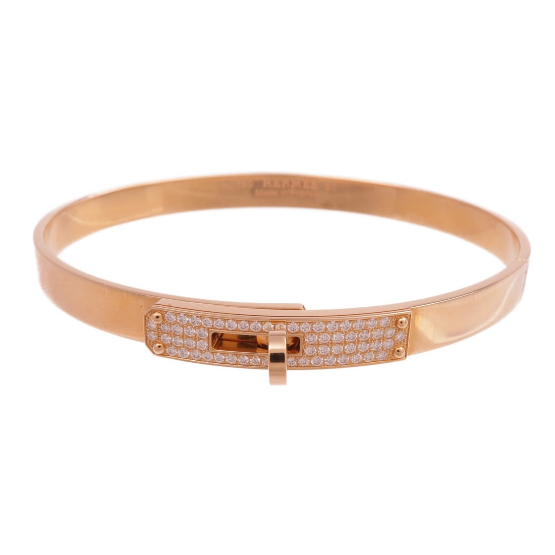 18K Rose Gold Diamond Bracelet by Hermes Kelly Collection: 18K Rose Gold Diamond Bracelet by Hermes Kelly Collection This Hermes Kelly Diamond Bracelet is crafted from 18K pink gold and features a diamond accent. Made in France, the bracelet is designed in a