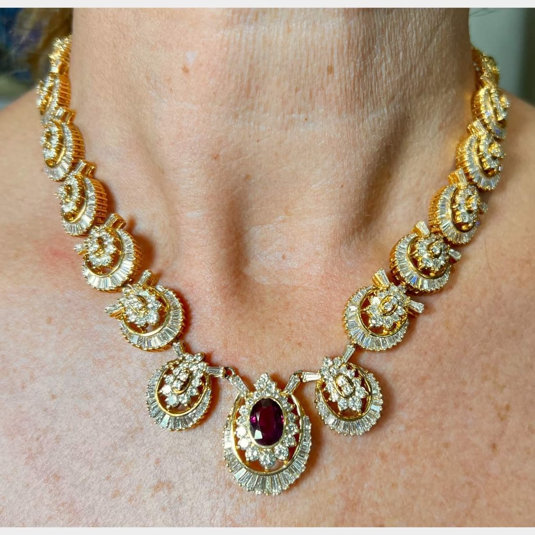 18K Yellow Gold Ruby 2.10 Ct and 861 Diamond Ring: 18K Yellow Gold Ruby 2.10 Ct and 861 Diamond Ring This exquisite 18K Yellow Gold Ruby and Diamond Ring features a stunning central ruby weighing approximately 2.10 Ct. The ring is adorned with an impr