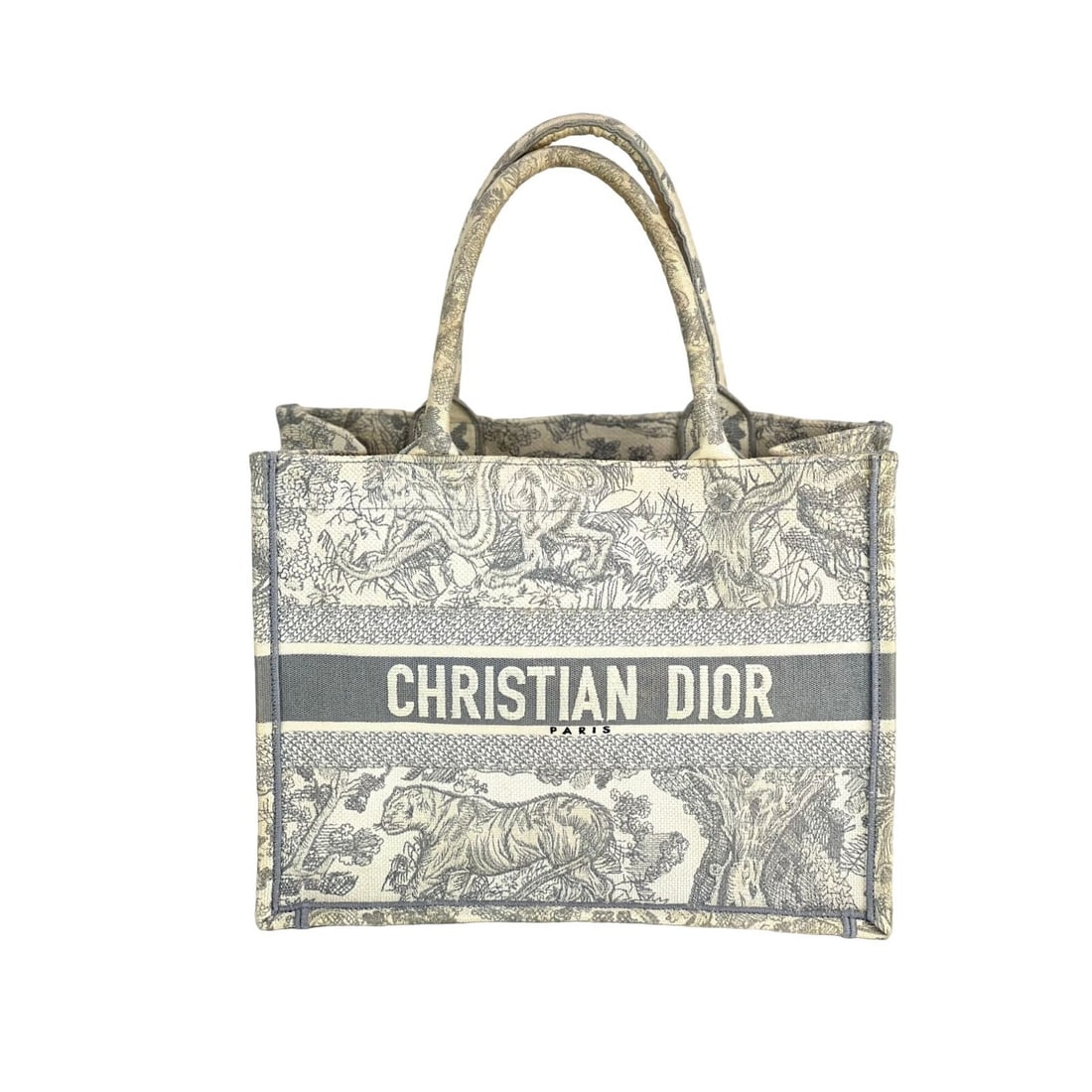 Christian Dior Dioriviera Medium Tote with Embroidered Tiger Pattern: Christian Dior Dioriviera Medium Tote with Embroidered Tiger Pattern This elegant medium tote from Christian Dior features a striking tiger pattern embroidered on durable canvas. With a spacious recta