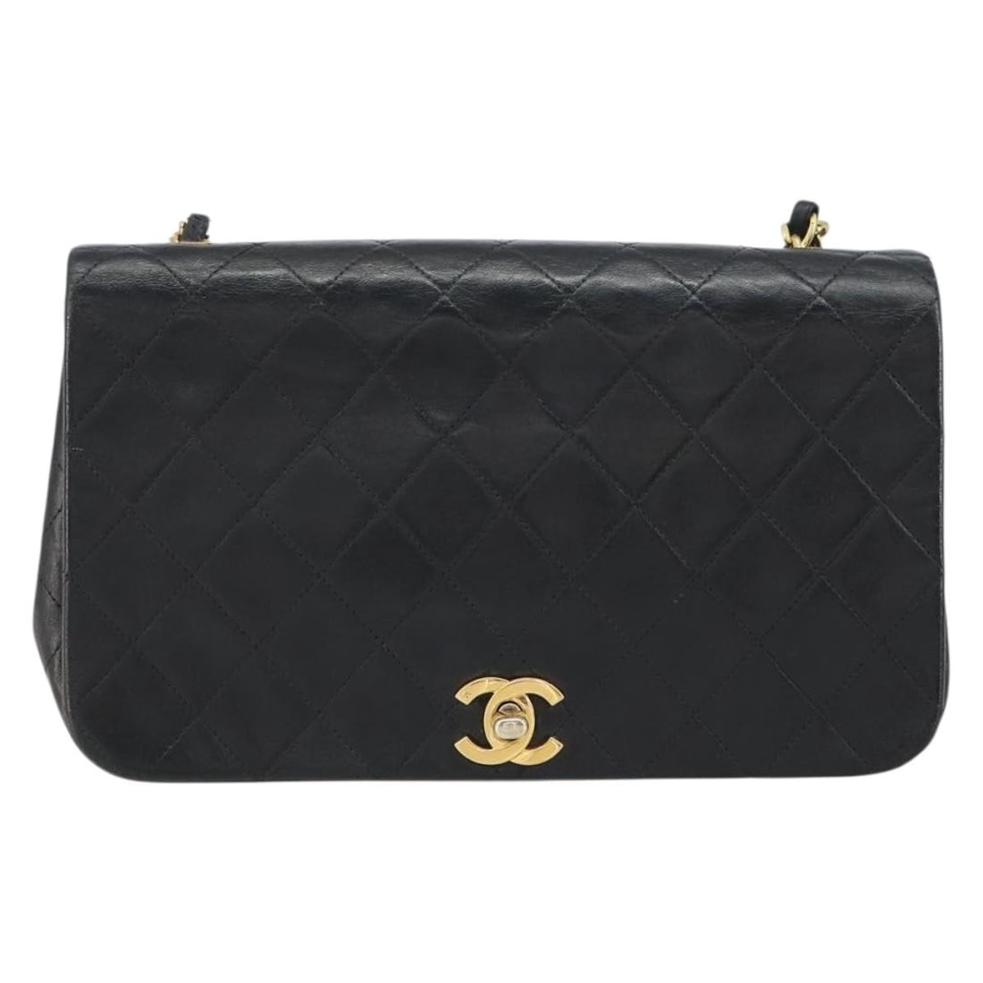 Black Vintage Chanel Full Flap Shoulder Bag: Black Vintage Chanel Full Flap Shoulder Bag This pre-owned Chanel vintage full flap shoulder bag features a black exterior with noticeable signs of wear, such as surface rubbing, slight loss of shape,