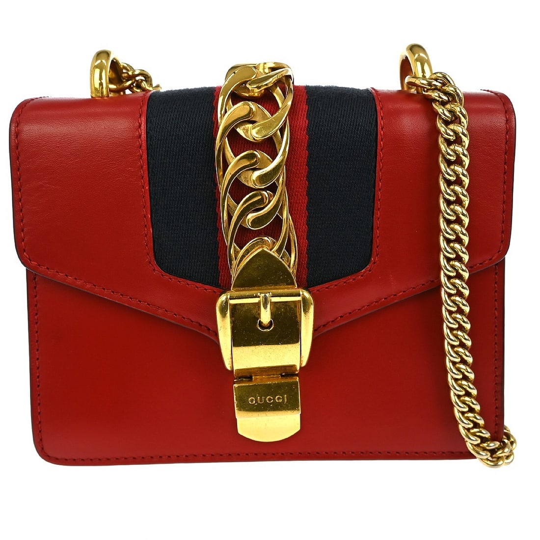 Red Sylvie Shoulder Purse by Gucci: Red Sylvie Shoulder Purse by Gucci This pre-owned Gucci Sylvie shoulder bag in red displays noticeable signs of wear, including scuffs and dirt on both the exterior and interior. It has a subtle stora