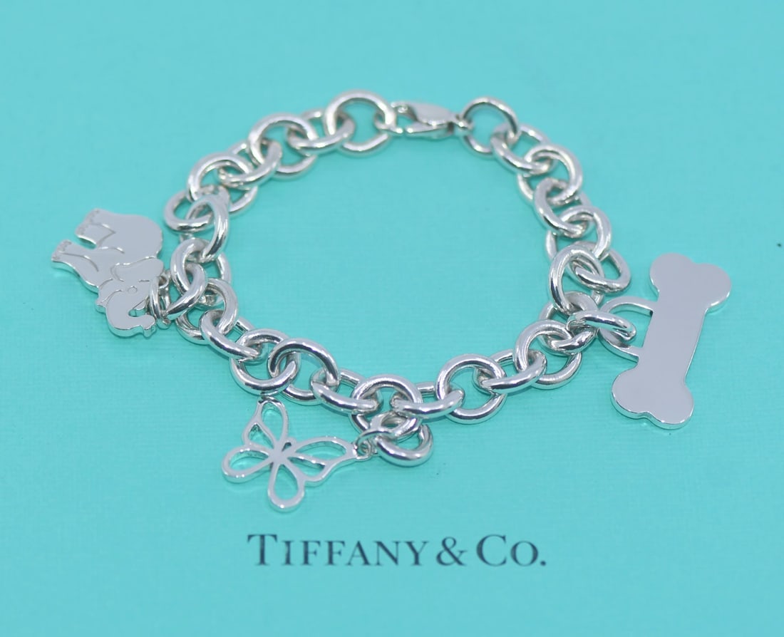 Tiffany & Co Elephant Butterfly Charm Bracelet Sterling Silver 925 Authentic: Tiffany & Co Elephant Butterfly Charm Bracelet Sterling Silver 925 Authentic This exquisite Tiffany & Co. Elephant Butterfly Sterling Silver Bracelet features a charming design that combines elegance