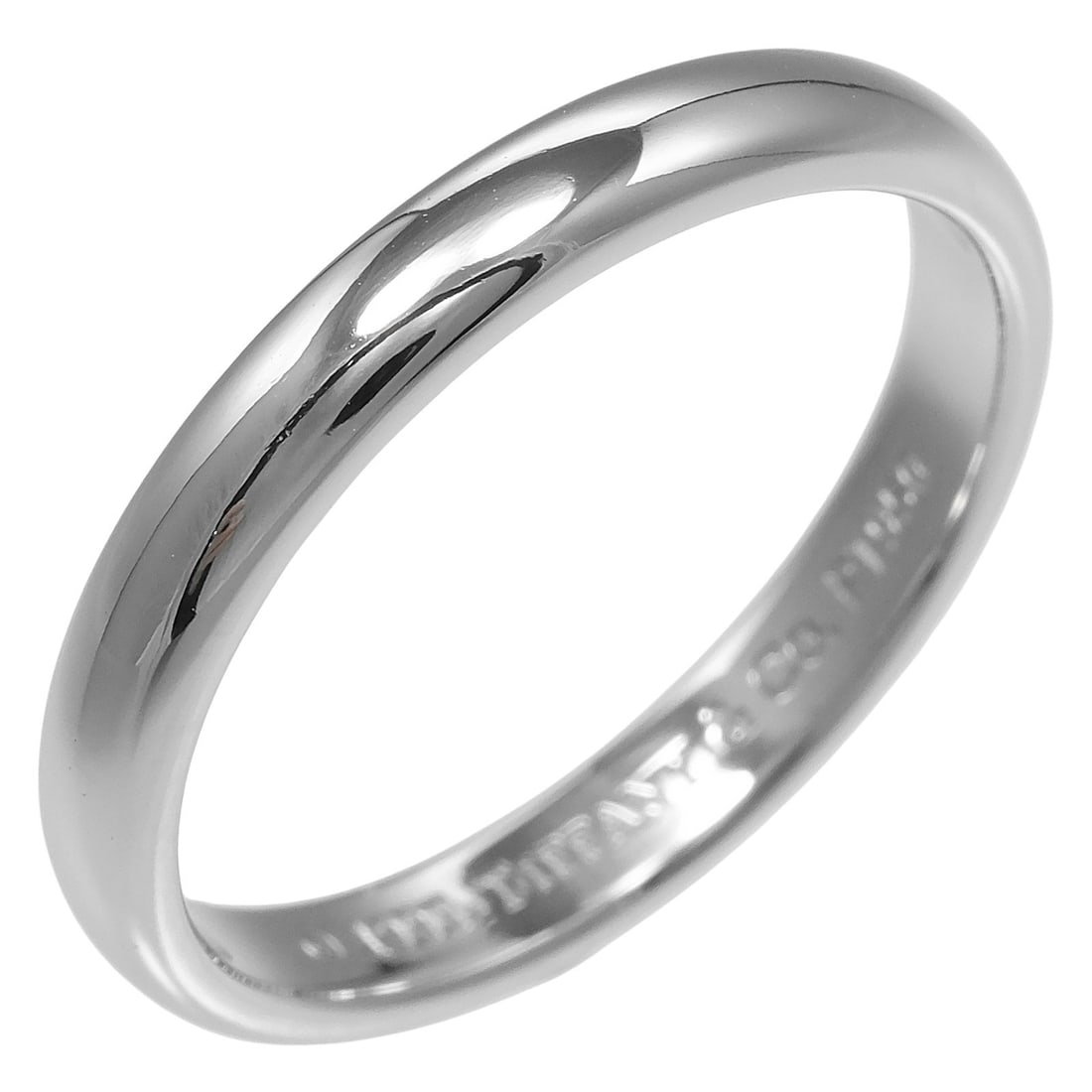 Forever Collection Wedding Band in Silver by Tiffany & Co.: Forever Collection Wedding Band in Silver by Tiffany & Co. This is a Tiffany & Co. Forever wedding band ring crafted in silver. Designed for women, the ring is a pre-owned item in excellent condition,