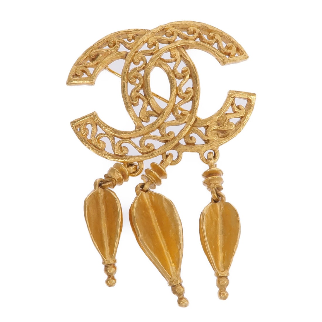 CHANEL Gold Metal CC Brooch Made in France: CHANEL Gold Metal CC Brooch Made in France Elevate your accessory collection with this exquisite CHANEL CC Brooch. This stunning piece is crafted in a luxurious gold color and features the iconic CC l