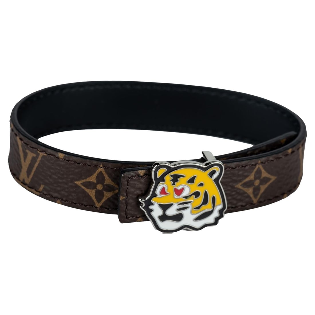 LV x Nigo 2021 Tiger Reversible Bracelet Monogram Canvas Calf Leather: LV x Nigo 2021 Tiger Reversible Bracelet Monogram Canvas Calf Leather Introducing the LV x Nigo Tiger Reversible Bracelet, a stylish fusion of British dandy and Japanese street culture. This playful b