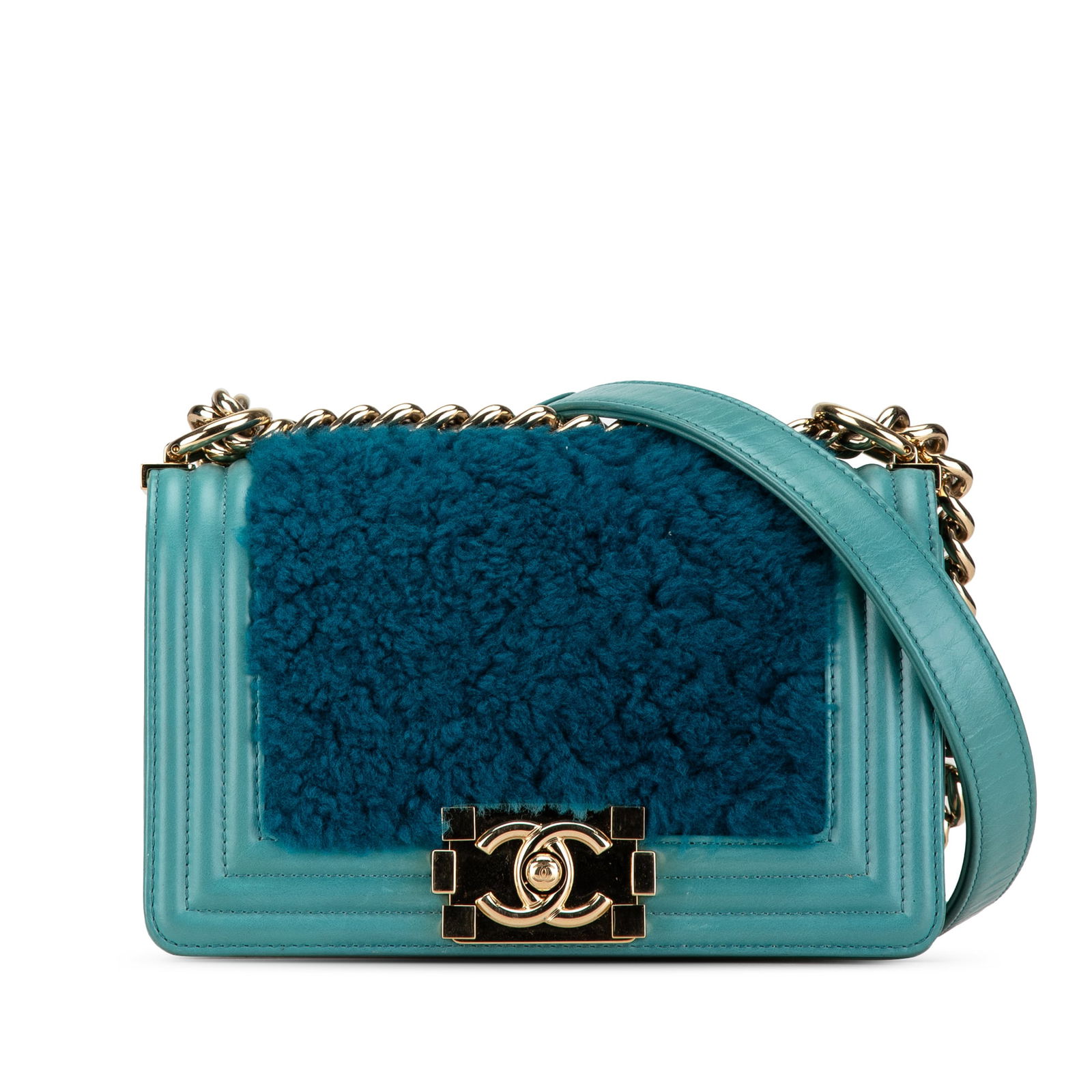 Small Shearling Boy Flap Shoulder Bag by Chanel in Blue: Small Shearling Boy Flap Shoulder Bag by Chanel in Blue Introducing the Chanel Small Shearling Boy Flap, a luxurious handbag featuring a soft fur body complemented by leather trim. This stylish bag bo