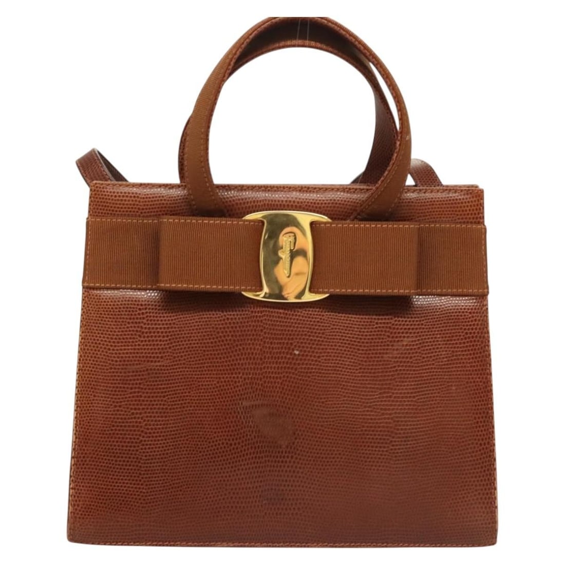 Convertible Vara Bow Handbag by Salvatore Ferragamo in Brown: Convertible Vara Bow Handbag by Salvatore Ferragamo in Brown This Salvatore Ferragamo Convertible Vara Bow Tote in brown is a women's handbag featuring the signature Vara bow detail. The bag shows sig
