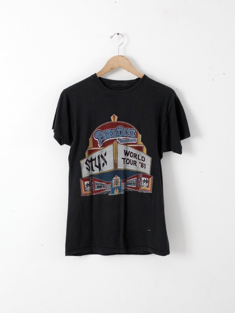 Vintage Styx 1981 Paradise Theatre Tour T-Shirt Black Cotton: Vintage Styx 1981 Paradise Theatre Tour T-Shirt Black Cotton Celebrate rock history with this vintage Styx t-shirt from the 1981 Paradise Theatre World Tour. Crafted from black cotton, this unique tee