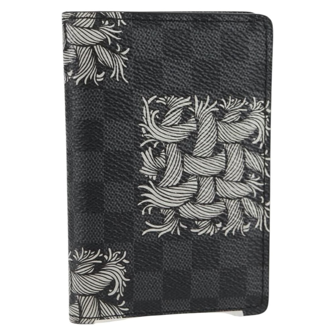 Pocket Organizer in Black Canvas by Louis Vuitton: Pocket Organizer in Black Canvas by Louis Vuitton This Louis Vuitton Pocket Organizer features a black exterior in excellent condition with no significant scratches. The interior and corners show slig