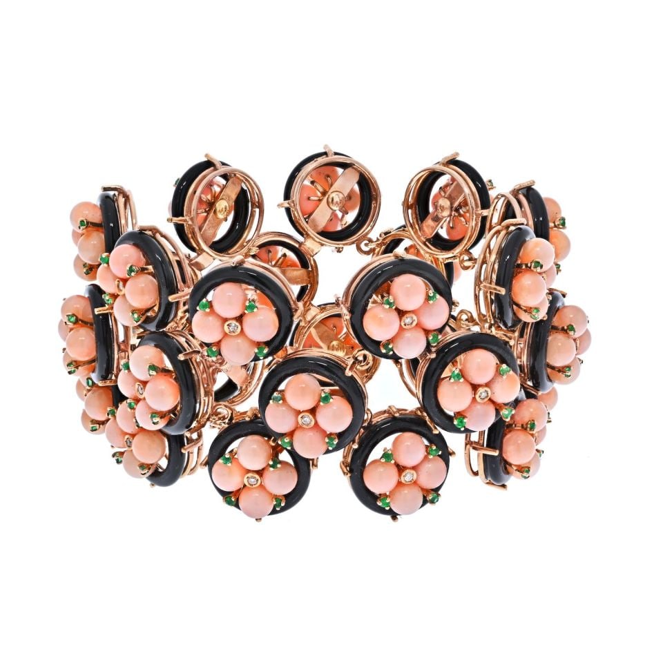 18K Yellow Gold Coral Flower Bracelet with Diamonds and Emeralds: 18K Yellow Gold Coral Flower Bracelet with Diamonds and Emeralds This exquisite bracelet showcases a stunning combination of 18K yellow gold, genuine baby pink coral, black enamel, diamonds, and green