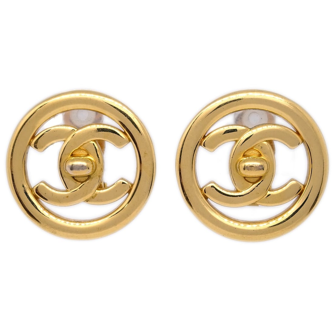 Chanel 97P Gold CC Turnlock Clip-On Button Earrings: Chanel 97P Gold CC Turnlock Clip-On Button Earrings Elevate your accessory collection with these exquisite Chanel CC Turnlock Button Earrings. These round, clip-on earrings feature a stunning gold-pla