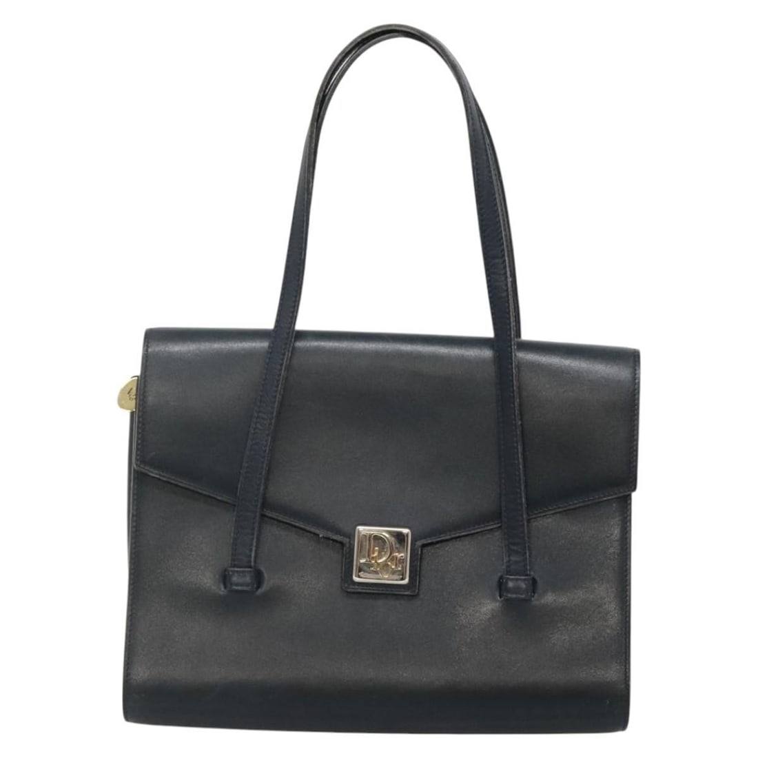 Vintage navy Christian Dior handbag with missing charm: Vintage navy Christian Dior handbag with missing charm This vintage Christian Dior handbag features a navy exterior and is designed for women. The bag shows signs of rubbing, slight shape loss, scratc