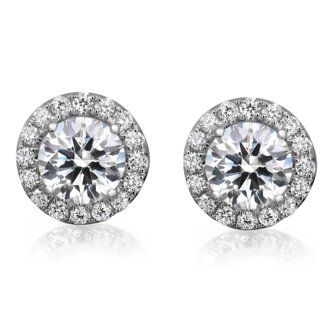 Rachel Koen 18K White Gold Lab Grown Diamond Halo Stud Earrings 2.53 Cttw: Rachel Koen 18K White Gold Lab Grown Diamond Halo Stud Earrings 2.53 Cttw Elevate your style with these stunning stud earrings featuring prong set round cut lab grown diamonds. Crafted in luxurious 18