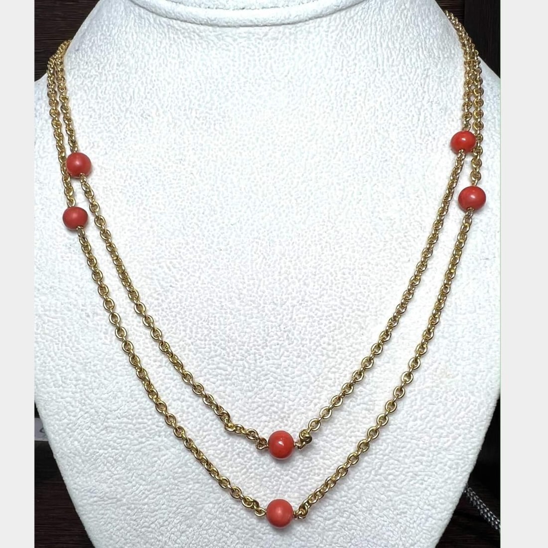 Vintage 1960's 18K Gold Coral Necklace with Hallmarks 65 in: Vintage 1960's 18K Gold Coral Necklace with Hallmarks 65 in This exquisite 1960's Italian necklace features luxurious 18K gold adorned with vibrant coral. With a remarkable length of 65 inches, this p