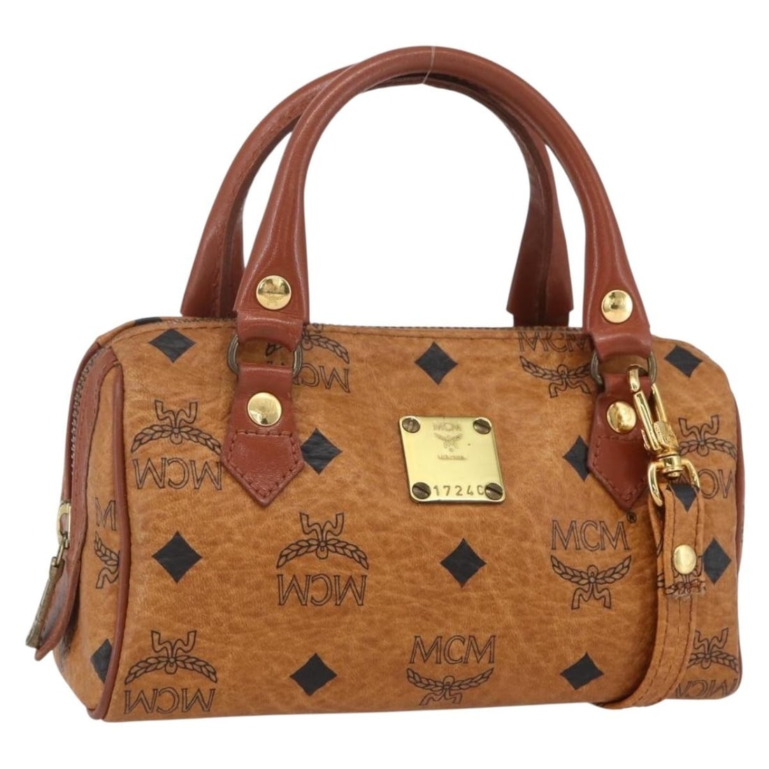 Brown Visetos Handbag by MCM: Brown Visetos Handbag by MCM This pre-owned MCM Visetos handbag features a brown exterior and is designed for female users. It is in good condition with minimal signs of use, including slight rubbing