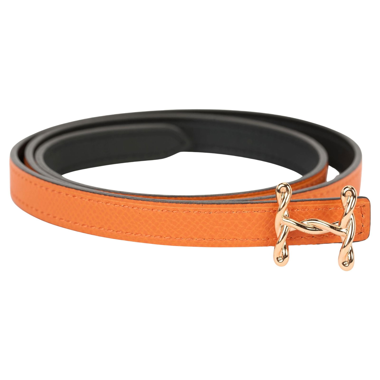Hermes Reversible Orange Epsom Leather Belt with Rose Gold Torsade H Buckle: Hermes Reversible Orange Epsom Leather Belt with Rose Gold Torsade H Buckle This exquisite Hermes reversible belt is crafted from luxurious epsom leather in a vibrant orange hue and supple black swift