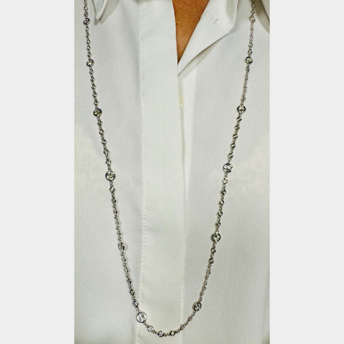 18K White Gold 36 Inch 9.00 Ct Diamond by the Yard Necklace: 18K White Gold 36 Inch 9.00 Ct Diamond by the Yard Necklace This exquisite 18K White Gold Necklace features a stunning 'by the yard' design, adorned with a total of 120 diamonds weighing approximately