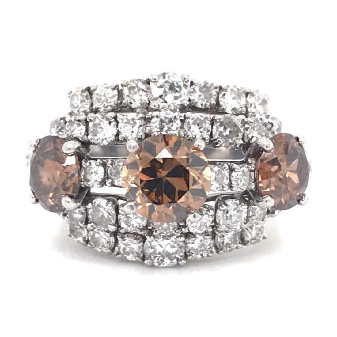 Stunning 4.25 Ct Diamond Cartier Platinum Ring: Stunning 4.25 Ct Diamond Cartier Platinum Ring This exquisite Cartier ring features a stunning 1.25 Ct center diamond, complemented by two side champagne diamonds totaling 1.70 Ct. The mounting is ado