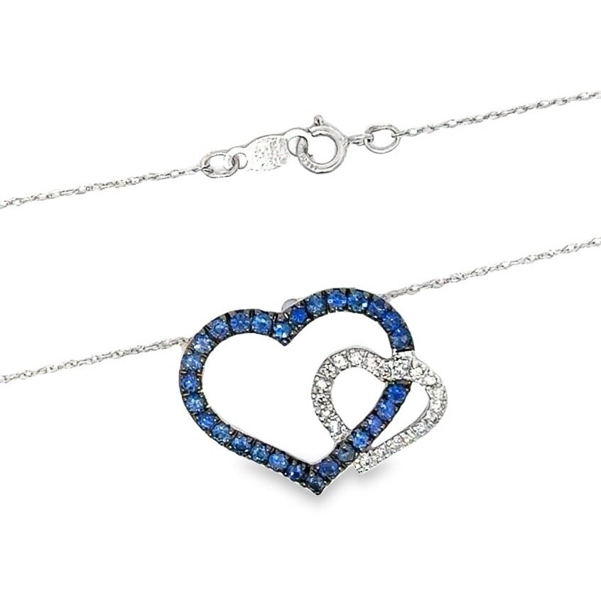 14K White Gold Dual Hearts Sapphire Diamond Pendant Necklace: 14K White Gold Dual Hearts Sapphire Diamond Pendant Necklace This exquisite 14K white gold slide pendant features dual interlocking hearts, elegantly adorned with natural sapphires and diamonds. The p