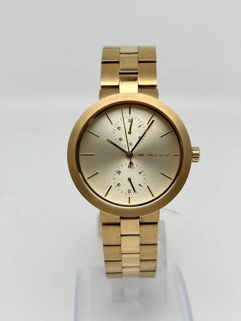 Michael Kors Garner Gold-Tone Quartz Watch Champagne Dial MK6408: Michael Kors Garner Gold-Tone Quartz Watch Champagne Dial MK6408 This Michael Kors Garner ladies quartz watch combines elegance with a casual style, perfect for any occasion. Featuring a stunning cham