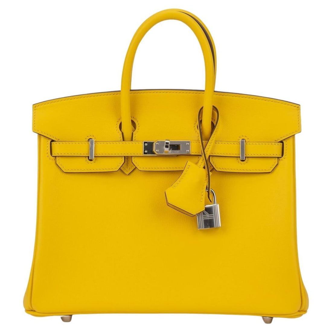Hermes Birkin 25 Jaune Naples Swift with Silver Palladium Hardware BNIB: Hermes Birkin 25 Jaune Naples Swift with Silver Palladium Hardware BNIB The Hermes Birkin 25 is a luxurious handbag crafted from swift leather in a vibrant Jaune Naples color. This stylish bag feature