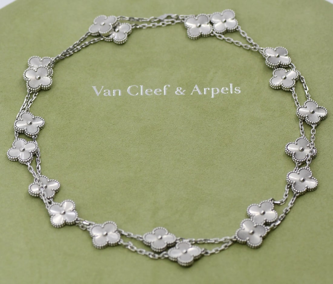 Vintage Alhambra 20 Motif Necklace in 18K White Gold by Van Cleef & Arpels: Vintage Alhambra 20 Motif Necklace in 18K White Gold by Van Cleef & Arpels This Van Cleef & Arpels Vintage Alhambra necklace features 20 motifs crafted from 18K white gold. The charm-style necklace is