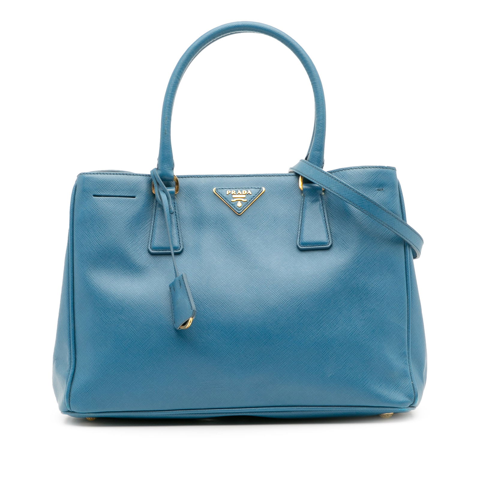 Prada Medium Saffiano Lux Galleria Satchel Blue Leather Bag: Prada Medium Saffiano Lux Galleria Satchel Blue Leather Bag Introducing the Prada Medium Saffiano Lux Galleria Satchel, a luxurious accessory crafted from high-quality saffiano leather. This elegant b