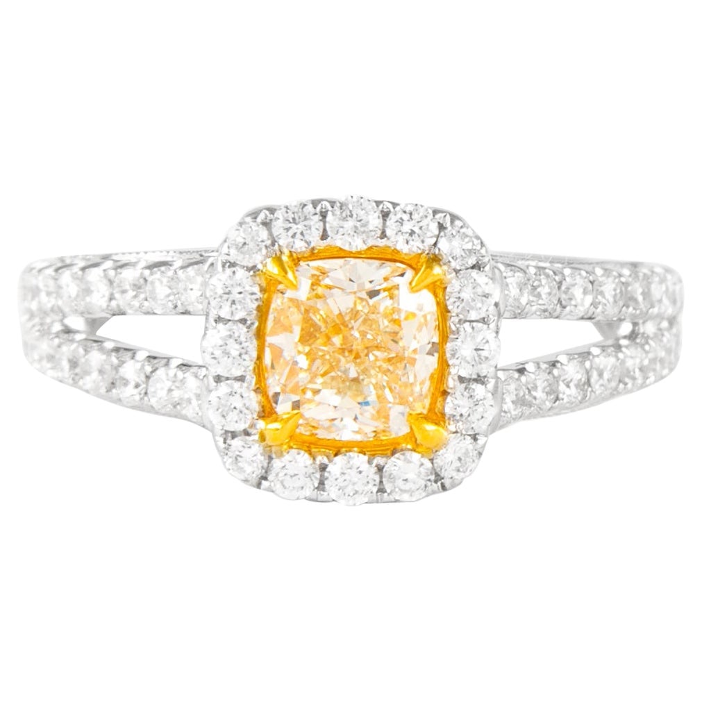 1.70ct Fancy Light Yellow VS2 Diamond Halo Ring 18k Gold EGL Certified: 1.70ct Fancy Light Yellow VS2 Diamond Halo Ring 18k Gold EGL Certified This exquisite ring features a stunning EGL certified Fancy Light Yellow diamond, totaling 1.70 carats. The centerpiece is a 1.01