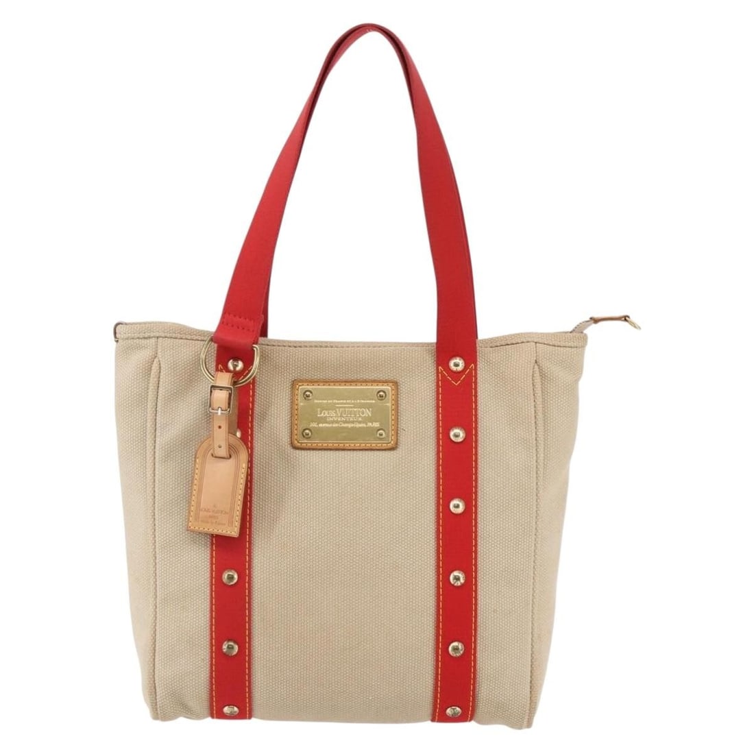 Antigua Cabas MM Tote Bag in Beige Canvas by Louis Vuitton: Antigua Cabas MM Tote Bag in Beige Canvas by Louis Vuitton This pre-owned Louis Vuitton Antigua Cabas MM tote bag features a beige canvas exterior with leather trim. The bag shows signs of previous us