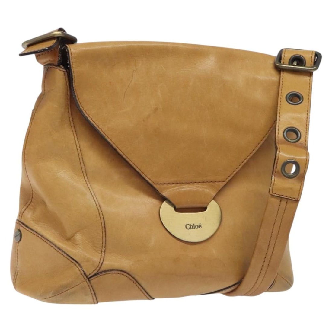 Brown Vintage Chloe Flap Shoulder Bag: Brown Vintage Chloe Flap Shoulder Bag This Chloe vintage flap shoulder bag is crafted in brown and designed for women. The exterior shows signs of use, including some loss of shape, rubbing, and stain