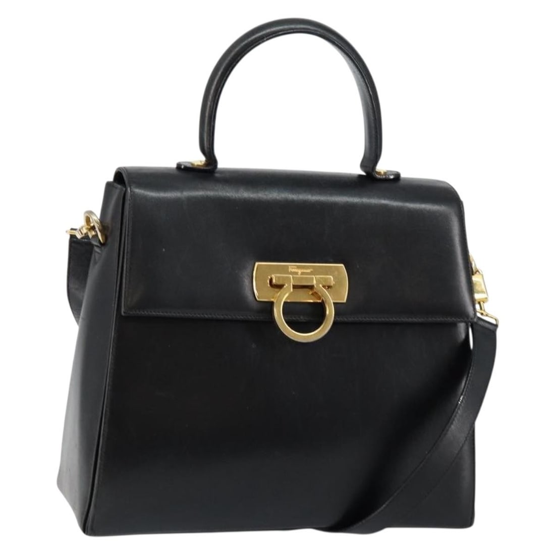 Gancini Convertible Top Handle Handbag by Salvatore Ferragamo in Black: Gancini Convertible Top Handle Handbag by Salvatore Ferragamo in Black This pre-owned Salvatore Ferragamo Gancini convertible top handle bag is crafted in black and designed for women. The handbag fea