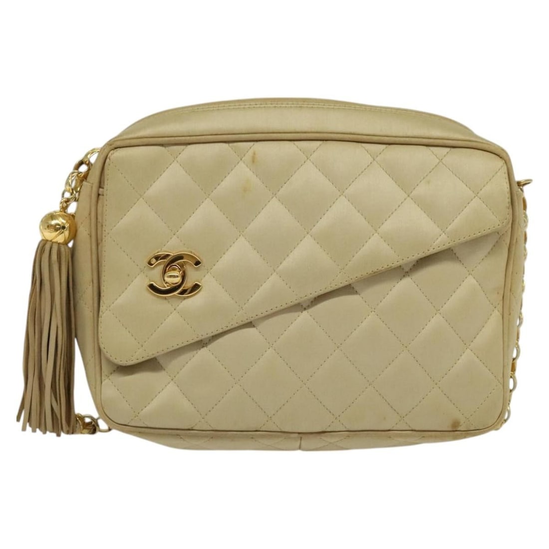 Chanel Beige Vintage Camera Bag with Front Pocket: Chanel Beige Vintage Camera Bag with Front Pocket This Chanel vintage front pocket camera bag features a beige exterior with a front pocket design. The bag shows signs of use including shape loss, rub