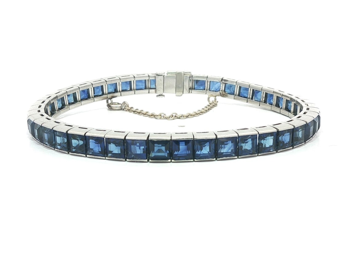 Vintage Platinum Bracelet GIA 14ctw Square Blue Sapphire Channel Set: Vintage Platinum Bracelet GIA 14ctw Square Blue Sapphire Channel Set This exquisite vintage bracelet features a stunning line of (44) natural genuine sapphires, each square step cut and channel set to