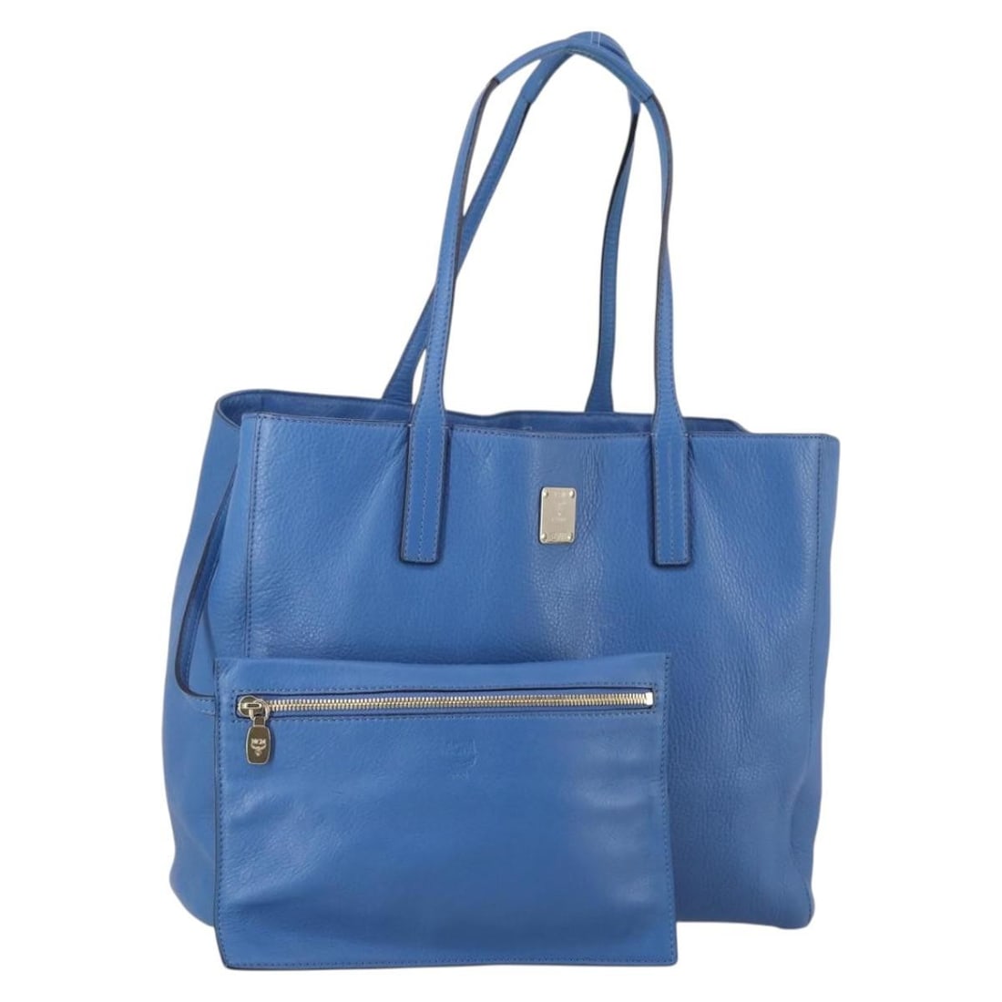 Blue MCM Pre-Owned Tote Bag with Minor Wear: Blue MCM Pre-Owned Tote Bag with Minor Wear This pre-owned MCM vintage blue tote bag is designed for women and features a spacious interior with multiple pockets. It is in good condition, showing mino