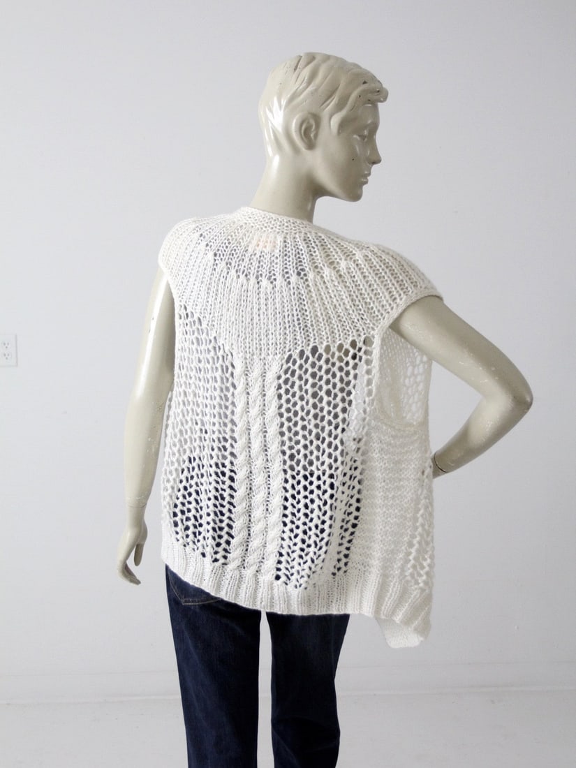 Vintage 80s White Acrylic Crochet Vest with Wood Buttons: Vintage 80s White Acrylic Crochet Vest with Wood Buttons This vintage 80s crochet cardigan vest is a unique addition to your wardrobe. Crafted from airy white acrylic, it features a lovely decorative