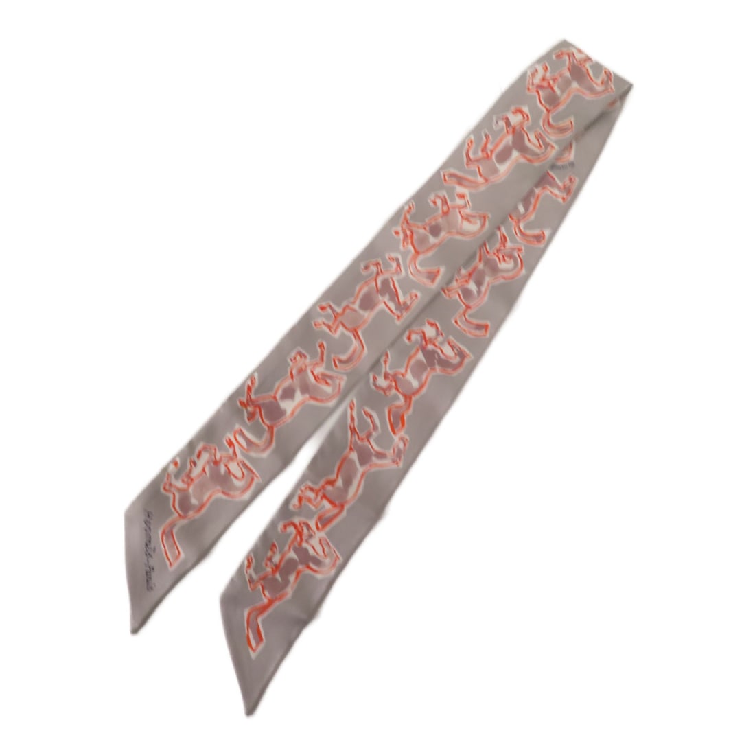 HERMES Gray Silk Twilly Scarf Made in France: HERMES Gray Silk Twilly Scarf Made in France This elegant HERMES Twilly Scarf is crafted from luxurious silk in a sophisticated gray shade. The scarf features a versatile design that can be styled in