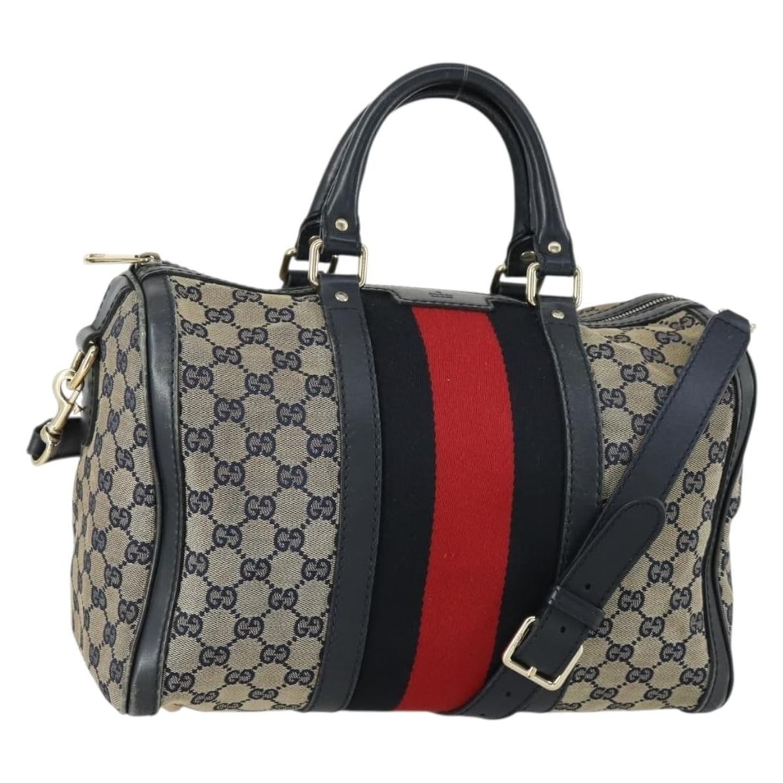Vintage Boston Handbag in Navy Web by Gucci: Vintage Boston Handbag in Navy Web by Gucci This pre-owned Gucci Vintage Web Boston Bag in navy is designed for female use and features a spacious interior. The bag shows significant signs of wear, in