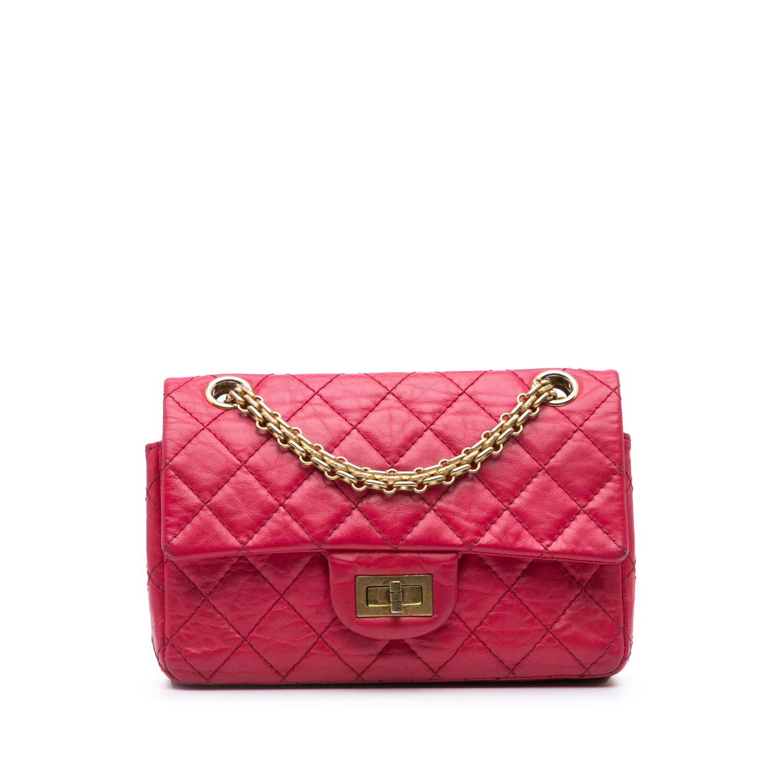 Chanel Mini Reissue 2.55 Pink Calfskin Flap Crossbody Bag: Chanel Mini Reissue 2.55 Pink Calfskin Flap Crossbody Bag The Chanel Mini Reissue 2.55 is a stylish crossbody bag crafted from quilted calfskin leather in a vibrant pink hue. It features elegant silve