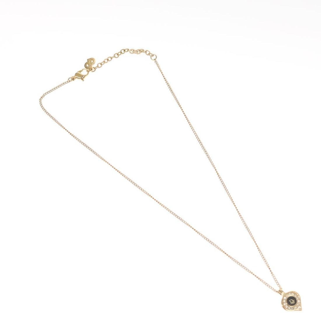 Heart Shaped Pendant Necklace Featuring Dior Logo Gold Tone: Heart Shaped Pendant Necklace Featuring Dior Logo Gold Tone This Christian Dior pendant necklace features a heart-shaped logo design with a gold finish. It is designed for female wearers and is in goo