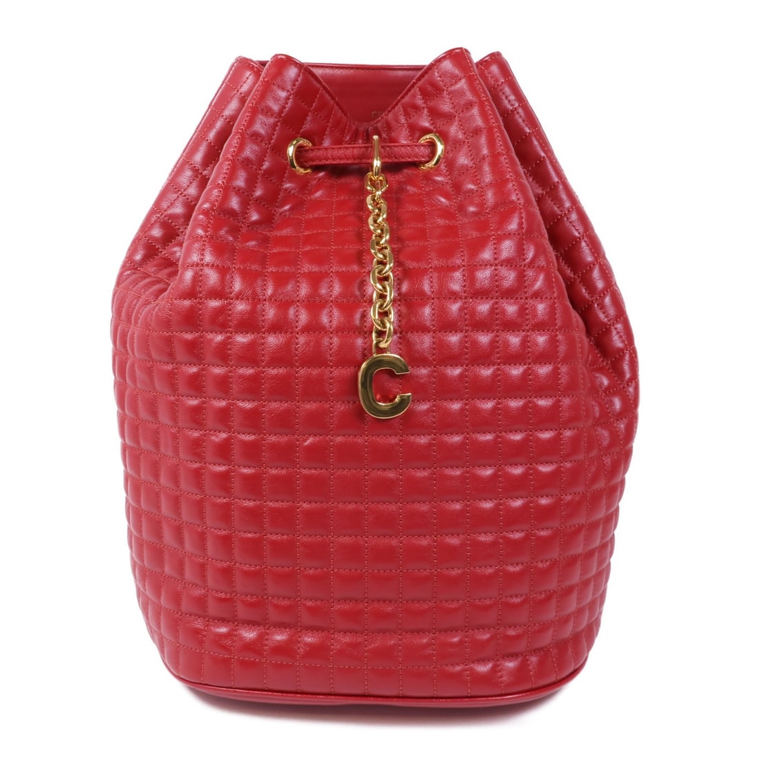 CELINE Red Calfskin Leather C Charm Bucket Backpack: CELINE Red Calfskin Leather C Charm Bucket Backpack This stunning CELINE C Charm Bucket Bag Backpack is crafted from luxurious calfskin leather in a vibrant red hue. This stylish rucksack features a s