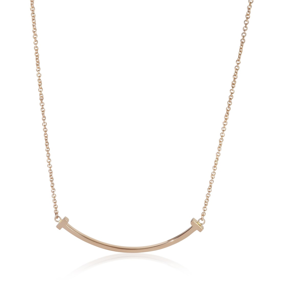 Tiffany & Co. 18k Rose Gold T Smile Pendant Necklace with Box: Tiffany & Co. 18k Rose Gold T Smile Pendant Necklace with Box Elevate your jewelry collection with the Tiffany & Co. Rose Gold Tiffany T Smile Pendant, a stunning piece crafted in Italy. This elegant