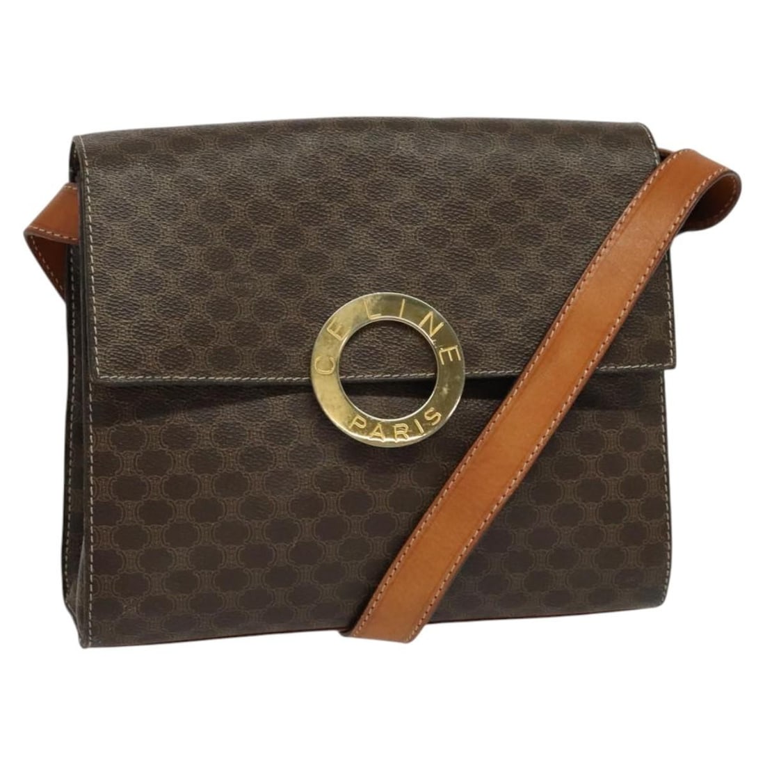 Macadam Circle Logo Shoulder Bag by Celine in Brown Vintage Style: Macadam Circle Logo Shoulder Bag by Celine in Brown Vintage Style This Celine vintage shoulder bag features the signature Macadam circle logo and a classic brown exterior. The bag shows signs of previ