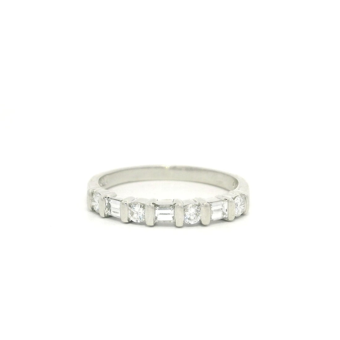 Platinum Band Ring with 0.50ctw Round & Baguette Diamonds: Platinum Band Ring with 0.50ctw Round & Baguette Diamonds This stunning band ring features a unique design with alternating round brilliant and baguette cut diamonds, expertly channel set in a luxurio