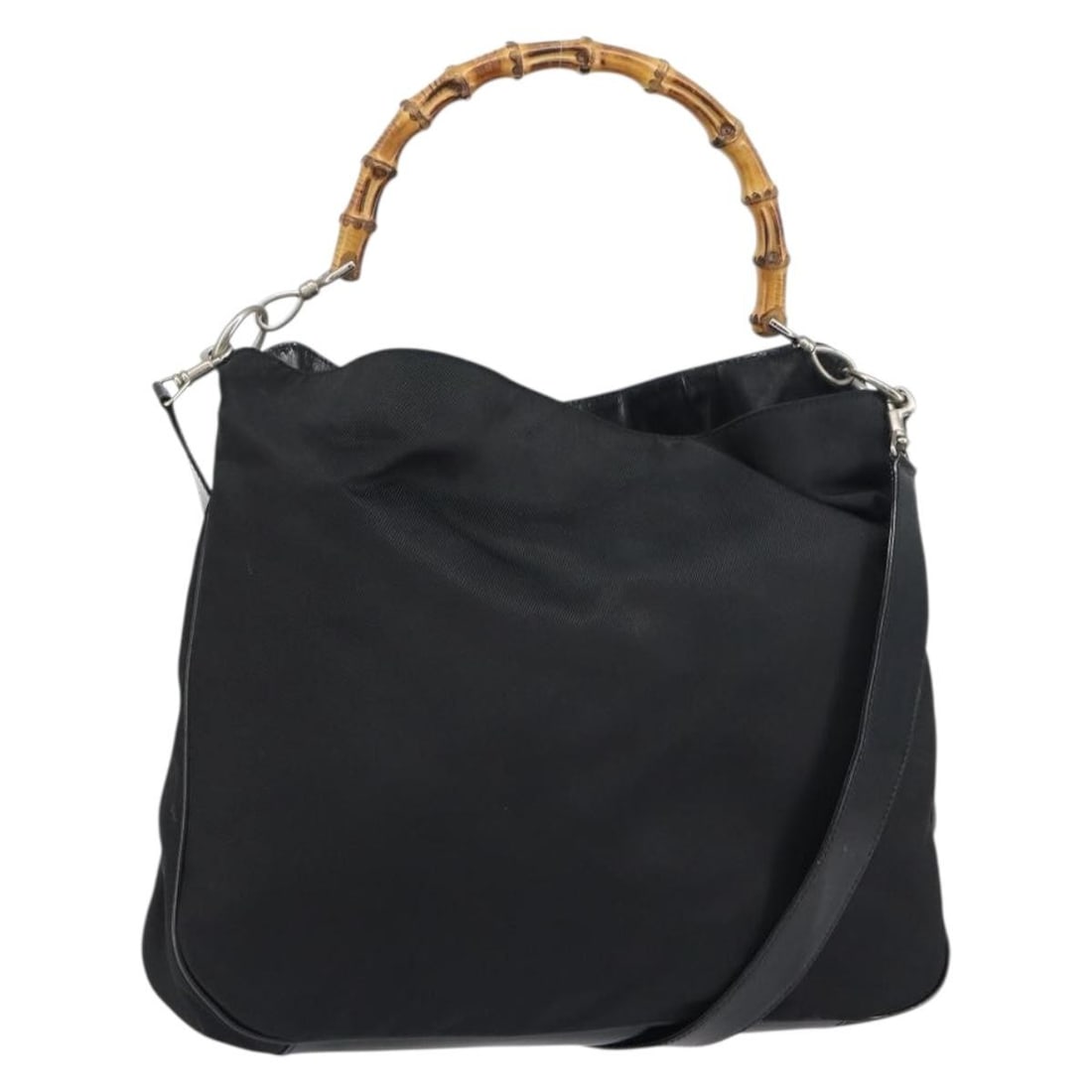 Black Bamboo Handle Vintage Handbag by Gucci: Black Bamboo Handle Vintage Handbag by Gucci This vintage Gucci Bamboo Handle Bag in black is a pre-owned handbag for women. It shows significant signs of wear, such as surface rubbing, loss of shape,