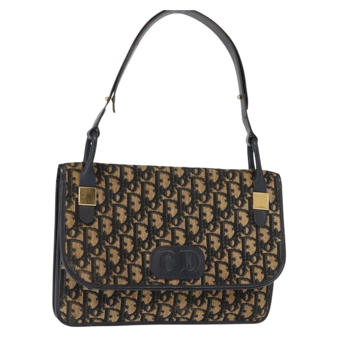 Vintage Dior Trotter Navy Canvas Shoulder Purse: Vintage Dior Trotter Navy Canvas Shoulder Purse This pre-owned Christian Dior vintage Trotter shoulder bag in navy features canvas construction with leather accents and metal fittings. It shows signs