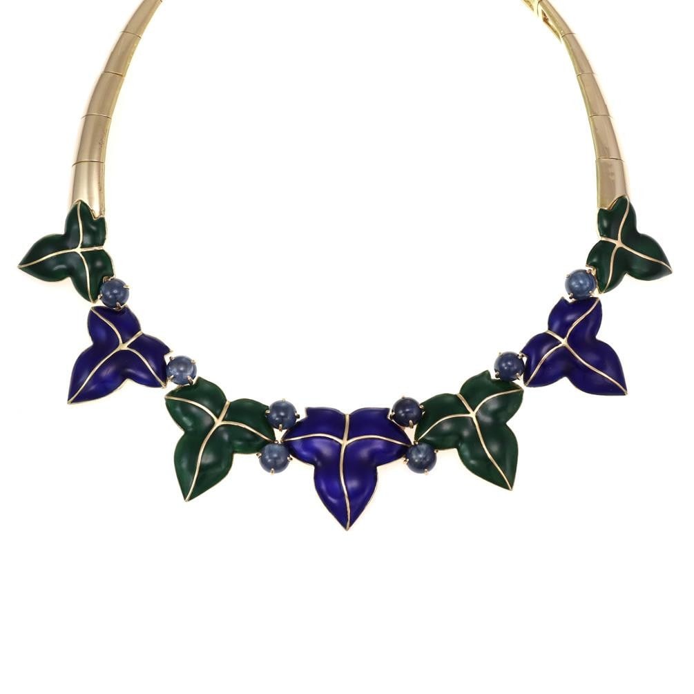 18k Yellow Gold Collar Necklace with Sapphire and Enamel Leaf Motif: 18k Yellow Gold Collar Necklace with Sapphire and Enamel Leaf Motif This vintage French collar necklace is crafted from 18k yellow gold and features a striking leaf design centerpiece with alternating