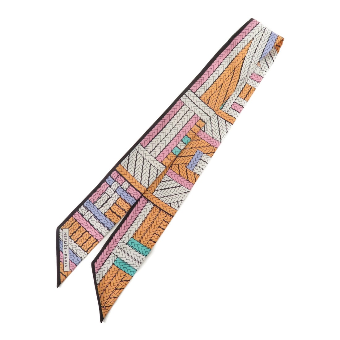HERMES Multicolor Silk Twilly Scarf Made in France: HERMES Multicolor Silk Twilly Scarf Made in France Elevate your style with this exquisite HERMES Twilly Scarf, crafted from luxurious silk. This multicolored scarf showcases a vibrant design, perfect