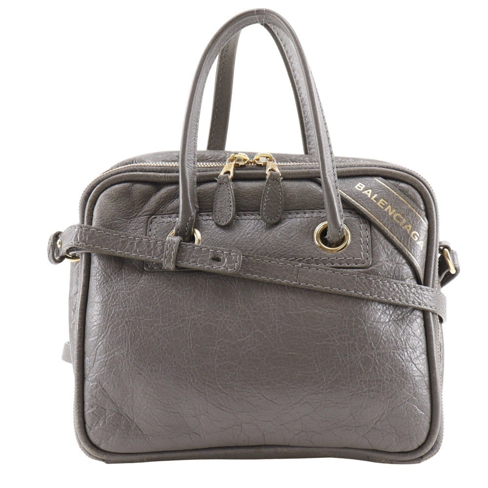 Gray Blanket Square Handbag by Balenciaga: Gray Blanket Square Handbag by Balenciaga This is a Balenciaga Blanket Square Bag in gray, designed for women. The handbag features a structured silhouette with notable scratches and corner thread wea