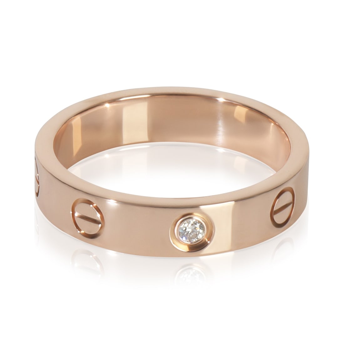 Small Model Love Ring in 18k Rose Gold with Diamonds by Cartier: Small Model Love Ring in 18k Rose Gold with Diamonds by Cartier This Cartier Small Model Love Ring is crafted in 18k rose gold and features round brilliant-cut white diamonds with a total carat weight